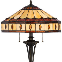 61" Bronze two-light floor lamp featuring a purple and ivory abstract Tiffany glass empire shade with intricate detailing.
