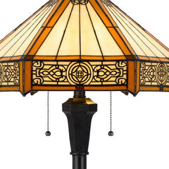 60" Bronze floor lamp featuring an orange and ivory abstract Tiffany glass empire shade with intricate patterns.