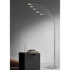 82" Nickel Five Light LED Arc Floor Lamp with sleek design and curved arms, illuminating a modern living space.