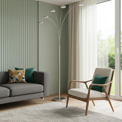 82" Nickel Five Light LED Arc Floor Lamp with curved arms, modern design, placed beside a cozy sofa and chair in a bright roo