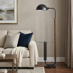 63" brown tray table floor lamp with a bronze transparent glass dome shade, featuring a sleek design next to a cozy sofa.