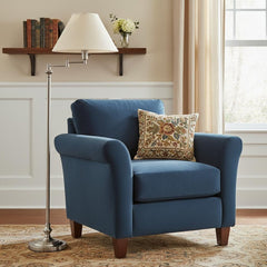 59" Nickel Swing Arm Floor Lamp with Beige Fabric Empire Shade next to a blue armchair with a decorative pillow in a cozy roo