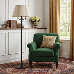 60" Bronze Metal Four Light Floor Lamp with Beige Fabric Square Shade beside a green armchair in a cozy living room setting.