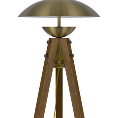 55" Brass Tripod Floor Lamp with an antiqued brass dome shade and wooden tripod base, featuring a stylish and modern design.