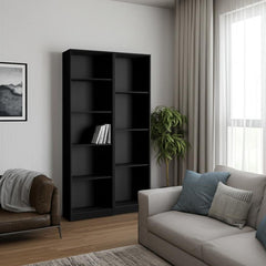 Set of two black wood multi-tier bookcases in a modern living room with a sofa and indoor plant.