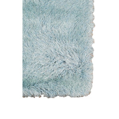Sky blue area rug with a soft, fluffy texture and a scalloped edge, measuring 9' x 14'. Ideal for cozy home decor.