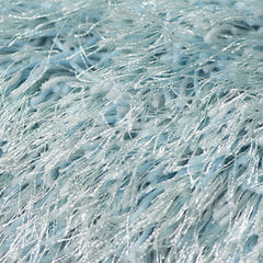 Soft, textured sky blue area rug with shimmering fibers, measuring 9' x 14', ideal for adding a cozy touch to any space.