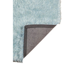 Sky blue area rug with a soft, fluffy texture and a black and gray backing, measuring 9' x 14'.