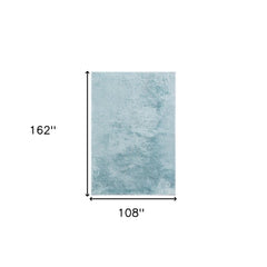 Sky blue area rug measuring 9' x 14', featuring a soft, plush texture and a solid color design.