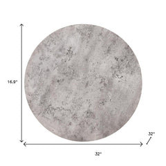 Set of two round nested coffee tables in gray and black wood with steel accents, measuring 32 inches in diameter and 16.9 inc