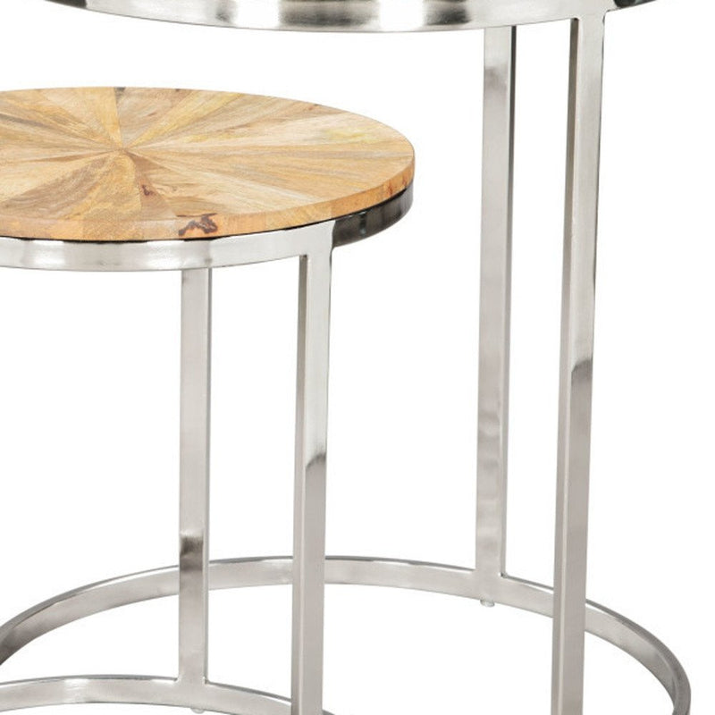 Set of two nested tables featuring natural wood tops and silver solid iron round frames, showcasing a modern design.