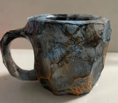 Mineral-design resin drinkware mug filled with hot coffee, styled on a wooden kitchen surface