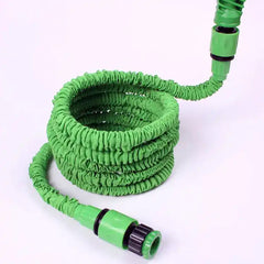 Expandable Hose & Pressure Washer for All Cleaning Needs in green, coiled and ready for use. Ideal for garden watering and outdoor cleaning tasks.