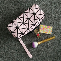 Sky Blue geometric diamond makeup bag open, showing nylon interior lining and main compartment