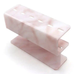 Close-up of the 6-hole Acrylic Pink Marble Eyelash Tweezer Rack Organizer, perfect for beauty salons and makeup stations.