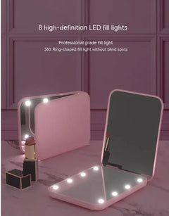 Rechargeable LED vanity mirror folded inside a travel purse showing compact fit