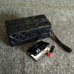 Portable PVC makeup clutch with zippered hidden pocket – close-up of zipper closure detail