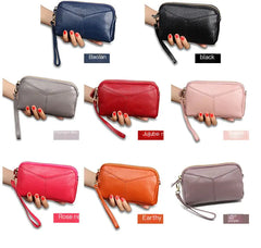 Compact leather box clutch bag for women displayed with dual top handles extended – lifestyle view